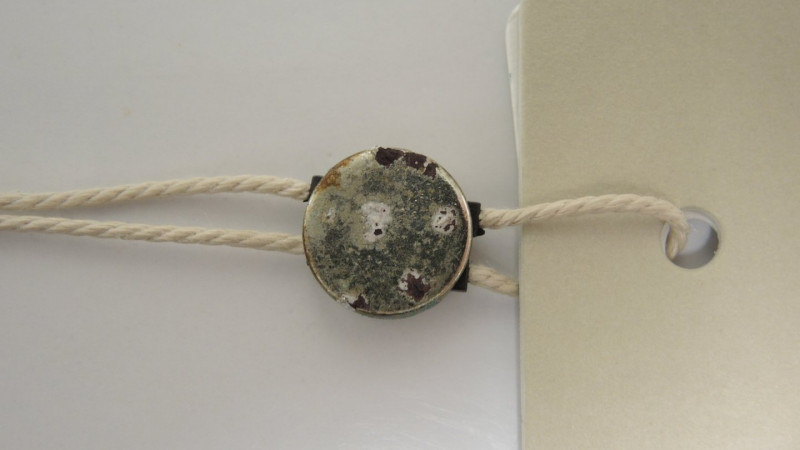 Korrosionserscheinungen an einer Plombe (galvanisierter Zinkdruckguss)